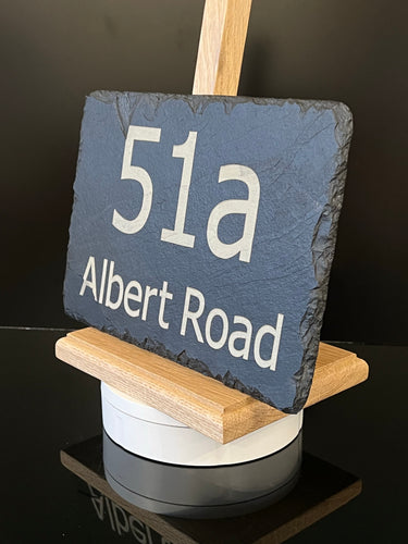 A natural slate house sign displaying the text '51a Albert Road' in engraved lettering.