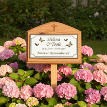 Memorial sign for Helena O'Toole surrounded by pink flowers