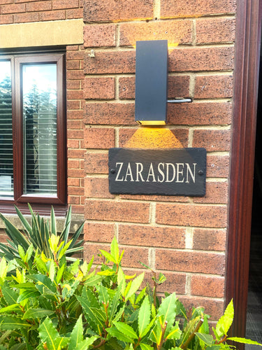 House sign with light above