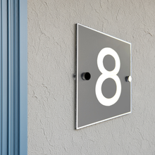 House number '8' on a gray background