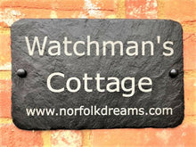 Holiday cottage and business signs with website or access details