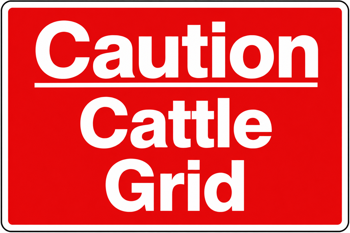 A red rectangular warning sign with white text reading 'Caution Cattle Grid' on a plain white background.