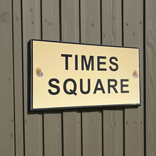 Times Square sign on a wooden background