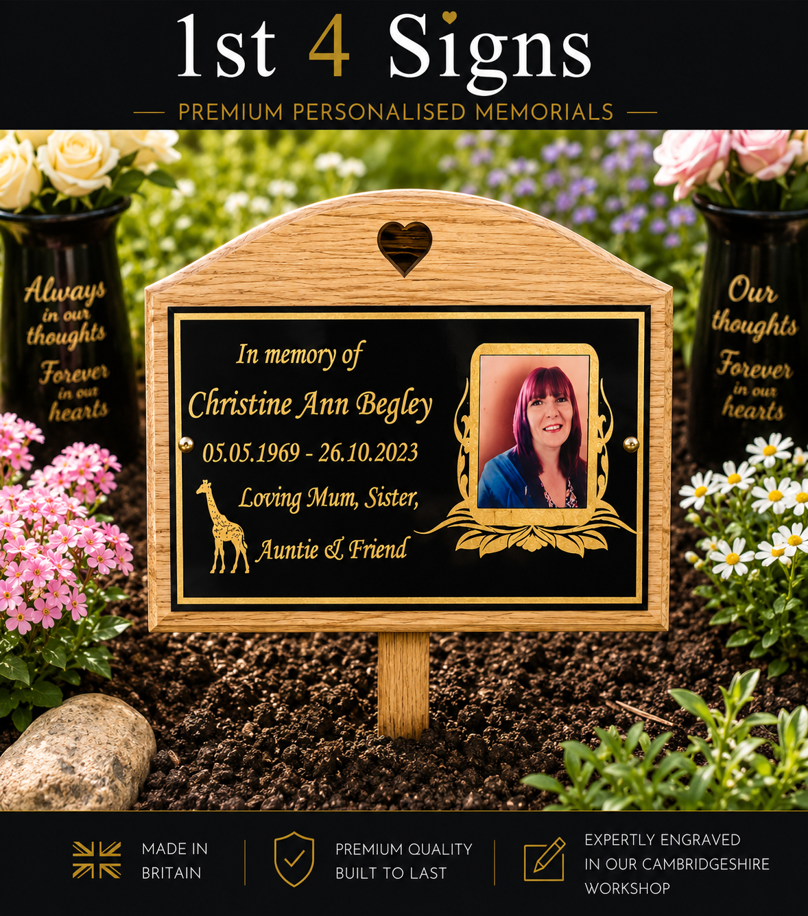 Personalized wooden garden memorial plaque with a black engraved center panel, gold decorative border, and a photo frame. The sign is shown planted in dark garden soil between flowers, with a black header at the top reading '1st 4 Signs' and feature badges along the bottom.