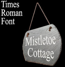 Slate sign with 'Mistletoe Cottage' in Times Roman font on a hanging rope