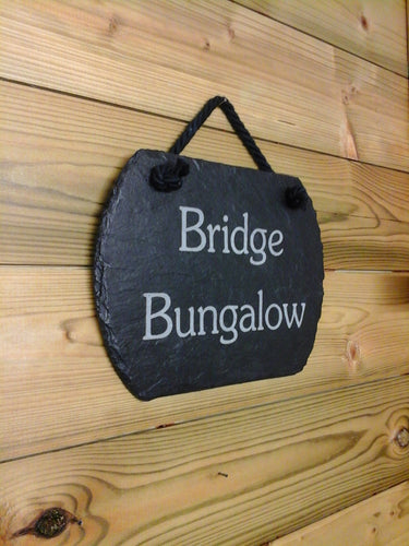 Slate sign with 'Bridge Bungalow' text on a hanging rope and rounded edges