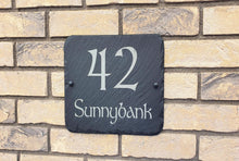 Signs for house on the village green