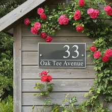 Wooden shed with a house number sign and pink roses