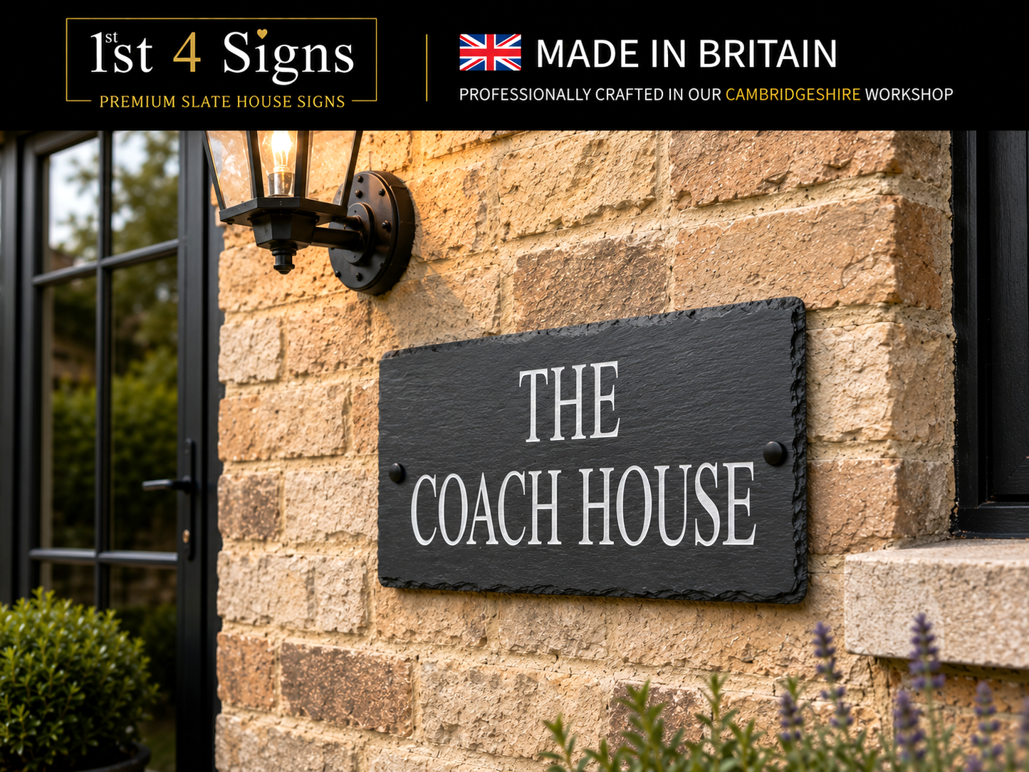 A rectangular black slate house sign with white lettering reading 'THE COACH HOUSE' mounted on a beige stone wall. A black wall lamp is visible to the left, with promotional text banners at the top reading '1st 4 Signs' and 'Made in Britain'.