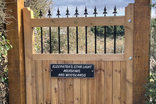 black aluminium sign with silver lettering