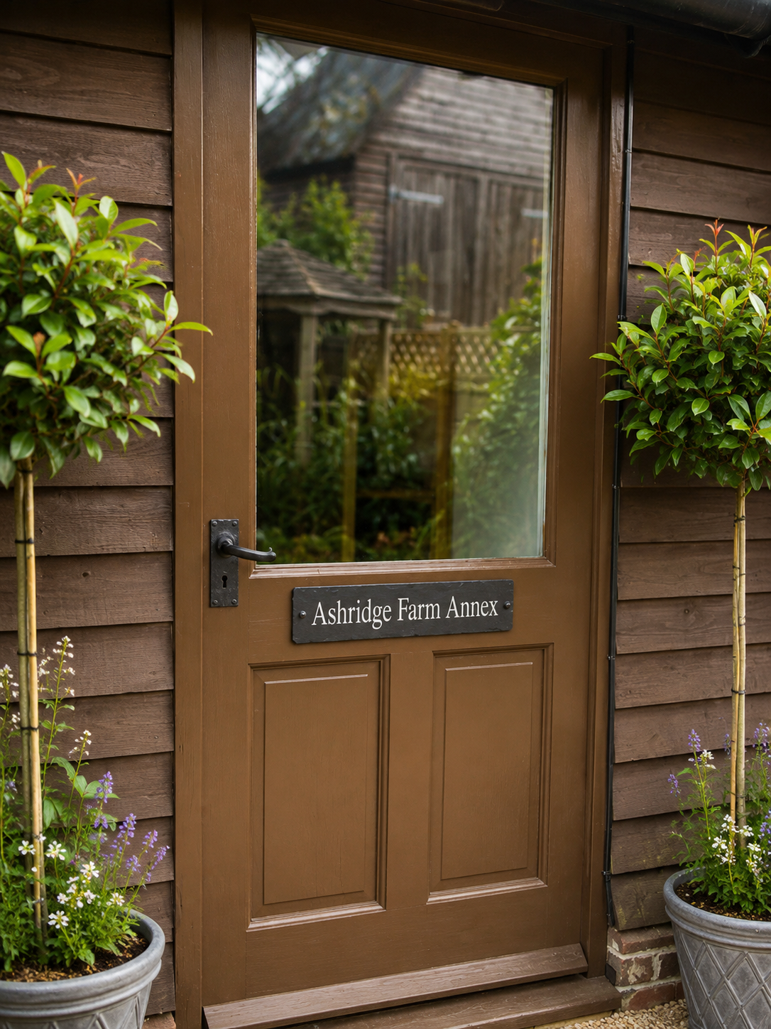 personalised painted slate house name sign with white airbrushed acrylic lettering on genuine natural slate, ideal for gate posts, entrance pillars and narrow wall spaces.