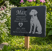 Memorial slate for a dog named Max with engraved text and a silhouette of a dog on a grassy background.