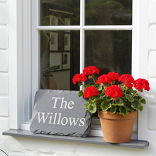 a slate cottage sign with personalised lettering
