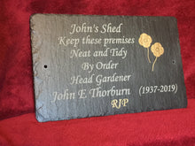 Memorial plaques for people with gold poppies